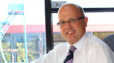 Managing director Andrew Wickham in the cab of a bus